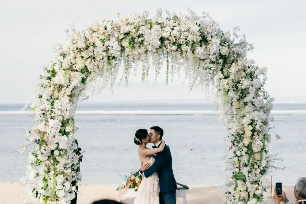 wedding arch infront of the beach